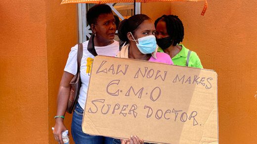 Protesters outside Parliament in Kingstown on Aug. 5, 2021, as lawmakers debated the law that would bring the mandate into effect. (iWN Photo)