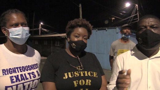 Activist Adriana King, centre, lawyer Israel Bruce, left, and Senator Shevern John, after King was granted bail Thursday night. (iWN photo)
