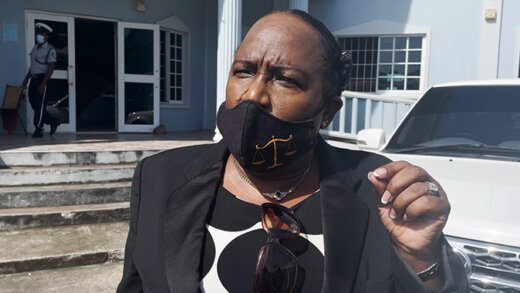 Counsel Kay Bacchus-Baptiste, lawyer for the virtual complainant, Cornelius John, speaks to reporters outside the court on Thursday, Nov. 18, 2021. (iWN photo)
