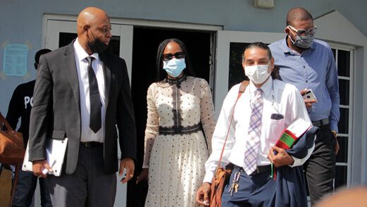 Ashelle Morgan, second from left, and Karim Nelson, right, and their lawyers leave the court after being freed of the charges on Thursday, Nov. 18, 2021. (iWN Photo)
