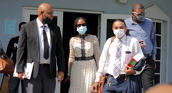 Ashelle Morgan, second from left, and Karim Nelson, right, and their lawyers leave the court after being freed of the charges on Thursday, Nov. 18, 2021. (iWN Photo)