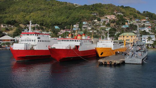 Ferries, along with SVG Coast Guard Vessel Capt. Hugh Mulzac, right, docked in Port Elizabeth, Bequia, on Saturday, Dec. 18, 2021, during the funeral of former prime minister, Sir James Mitchell. (iWN Photo)