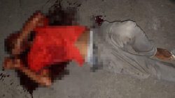 The injured man in a pool of blood on Halifax Street Thursday night.