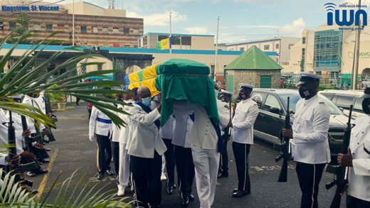 Member of the Royal St. Vincent and the Grenadines Police Force takes Sir James' casket into the House of Assembly on Friday, Dec. 17, 2021. (iWN photo)