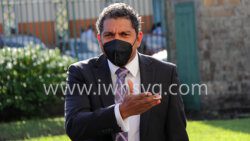 Minister of Finance Camillo Gonsalves gestures to a parliamentary colleague as he arrives at Parliament on Monday afternoon. (iWN photo)