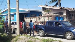 Police and onlookers at near the Owia Clinic on Sunday. (Photo: Rochelle Baptiste/Facebook)