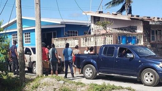 Police and onlookers at near the Owia Clinic on Sunday. (Photo: Rochelle Baptiste/Facebook)