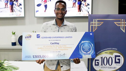 Cenus Hinds, of CariWay and his US$5,000 cheque for winning the first leg of the competition.