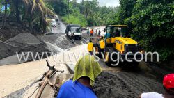 A tractor helps vehicles to cross the river at Noel on Aug. 23, 2021.