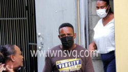 From left, defence counsel Kay Bacchus-Baptiste, the accused Ken Findlay, and witness Odette John, Findlay's girlfriend leave the Serious Offences Court on Feb. 9, 2022.