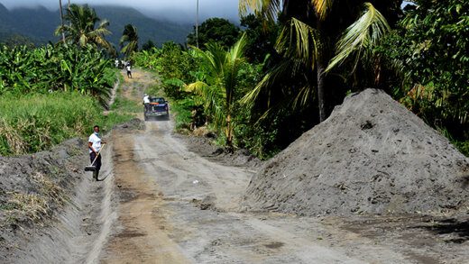 Workers, hired by BRAGSA, cleaning up volcanic ash.