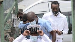 Lennox Andrews, Brydon Joseph, and Shemai Joseph, three of the give men are escorted to the High Court on April 13, 2022.