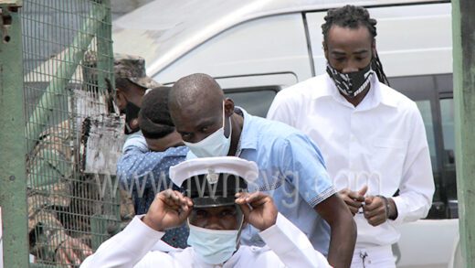 Lennox Andrews, Brydon Joseph, and Shemai Joseph, three of the give men are escorted to the High Court on April 13, 2022.