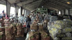 Traffickers prepare produce for export in Kingstown on Sunday, April 10, 2022.