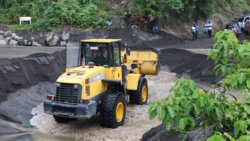 A tractor removes debris deposited by a lahar in northeastern St. Vincent in April. 