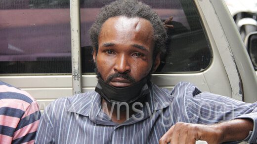 Casmore Hepburn sits in a police pickup as he awaits transportation to prison on Thursday, June 9, 2022.