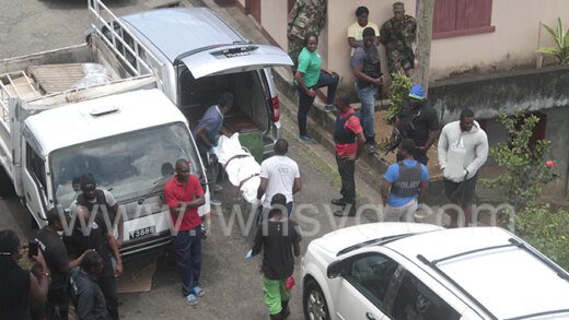 Funeral home workers remove the body of Gleason Lewis from the scene in Campden Park on April 26, 2020.