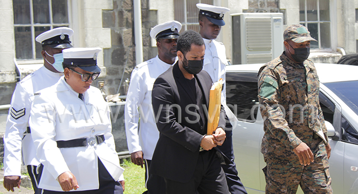 Police officers escort Veron Primus to prison on Thursday, June 23, 2022 during his trial.