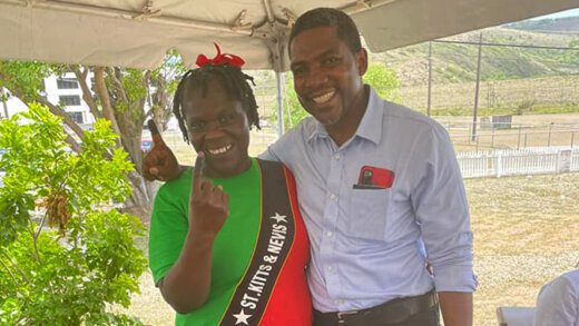 Prime Minister-elect Dr. Terrance Drew and a supporter on election day, Friday, Aug. 5, 2022.