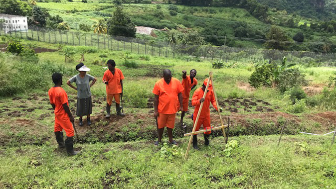 Prisoners with trainer V. Roudette practicing land contouring