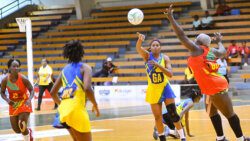 SVG goal attack makes a pass to SVG captain and wing attack Ruthann Williams against Grenada. (Photo: Robertson S. Henry)