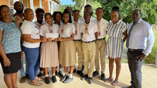 From left: Form teacher Ms Williams, members of the LOV Community Organization -- Omar Samuel, Valcina King-Gregg; students of the Canouan Secondary School, LOV member, Lavern King; school principal, Terry Ollivierre.  