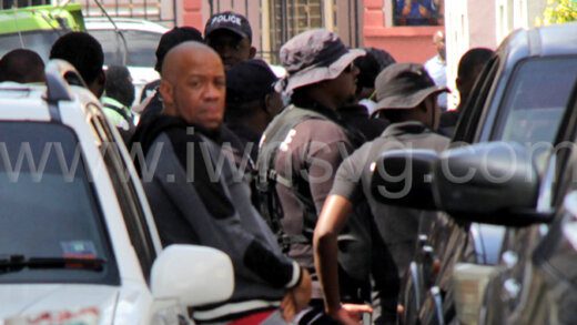 Jawansa “Sanga” Fraser looks on as police conduct an operation in Paul's Avenue on Nov. 17, 2022. Fraser was shot and injured during a drive by shooting in the community Friday night.