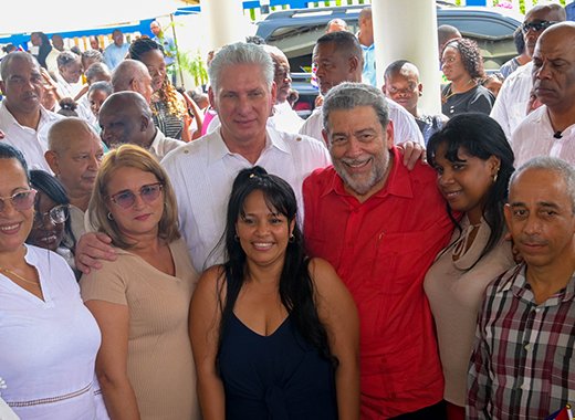 President of Cuba, Miguel Díaz-Canel and Prime Minister Ralph Gonsalves pose with Cuban health care workers at the Modern Medical and Diagnostic Centre in Georgetown on Sunday, Dec. 4, 2022. (Photo: API/Facebook)