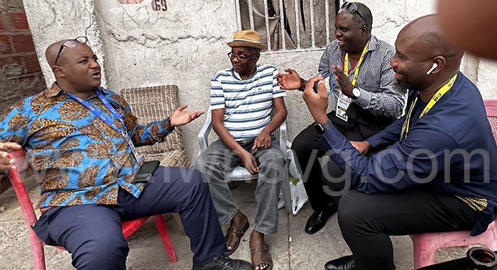 Interacting with Angolan journalists Sousa Jamba, left, Salas Neto, who is blind, centre, and Herculano Coroado, in Nelito Soares District Angola’s capital, Luanda, on Dec. 10, 2022.