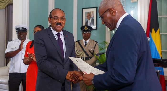 Gaston Browne, left, is sworn in, on Thursday, for a third consecutive term as Prime Minister of Antigua and Barbuda. (Photo: ABS Television/Radio/Facebook)