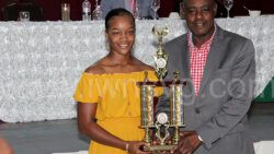 Police Sportswoman of the Year, Constable 944 Kimone Homer, left, receives here award from Minister of Sports, Frederick Stephenson at the event on Friday, Dec. 30, 2022. 