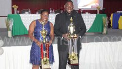 Policewoman of the Year 2022, Corporal Lafleur Williams, left and Policeman of the Year, Sergeant Biorn Duncan post with their trophies at the ceremony in Kingstown on Friday, Dec. 30, 2022. 