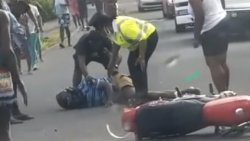 A traffic warden and members of the public respond to the crash in Colonarie on Feb. 7, 2023. 