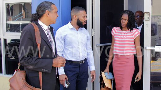 From left: Lawyer Ronald "Ronnie" Marks, Jorge Da Silva, of Rent-To-Own, the claimant Esther Harry, and counsel Stephen Huggins leave the Kingstown Magistrate's Court after the hearing on Sunday, Feb. 6, 2023.