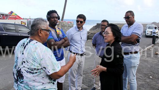 Head of the UN Office for Disaster Risk Reduction, Mami Mizutori interact in Sandy Bay on Feb. 8, 2023 with people affected by the April 2021 eruption of La Soufriere volcano. 