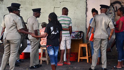 Senior police officers interact with people in Rose Place on Jan. 26, 2023, as part of the constabulary's community outreach programme. (Photo: Facebook?RSVG Police Force)