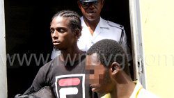 police escort murder accused Javid Dasilva and the 15-year-old youth from the Serious Offences Court on Monday, March 6, 2023.