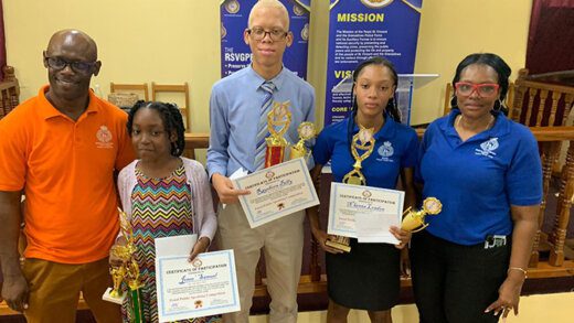 National Coordinator Sergeant Stephen Billy and South East Zonal Coordinator, Yoland London with N'kenna London, winner of senior category, Rayshorn Billy, second place in senior, and Jenee' Samuel, winner of the junior category.