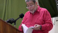 Prime Minister Ralph Gonsalves reads in Kingstown, on April 5, 2023, from what he said is the loan agreement with Taiwan. 