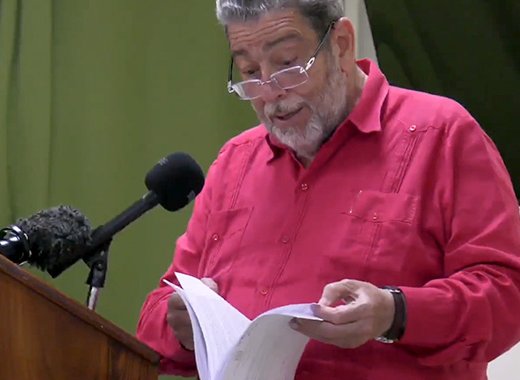 Prime Minister Ralph Gonsalves reads in Kingstown, on April 5, 2023, from what he said is the loan agreement with Taiwan. 