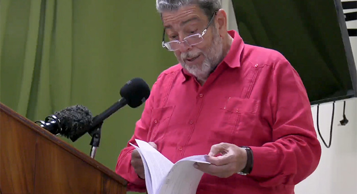 Prime Minister Ralph Gonsalves reads in Kingstown, on April 5, 2023, from what he said is the loan agreement with Taiwan. 