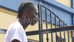 Giovannie Grant on his way to prison for assaulting his girlfriend in Kingstown.