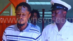 Roneake Burke leaves the Georgetown Magistrate’s Court in police custody on July 17, 2023 after failing to secure a surety. 