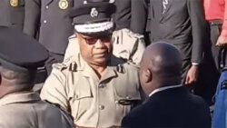 Commissioner of Police Colin John greets an officer during the parade on Thursday, Sept. 28, 2023.