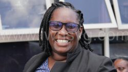 Prosecutor acting Corporal of Police Corlene Samuel, who completed a university degree with first class honours in July, laughs as she interacts with people outside the Kingstown Magistrate's Count on Thursday, Sept. 14, 2023.