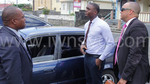 Prosecutors Inspect of Police Renrick Cato, left, and acting Corporal of Police Shamrack Pierre, centre, chat with lawyer Grant Connell outside the Serious Offences Court on Monday, Sept. 11, 2023.