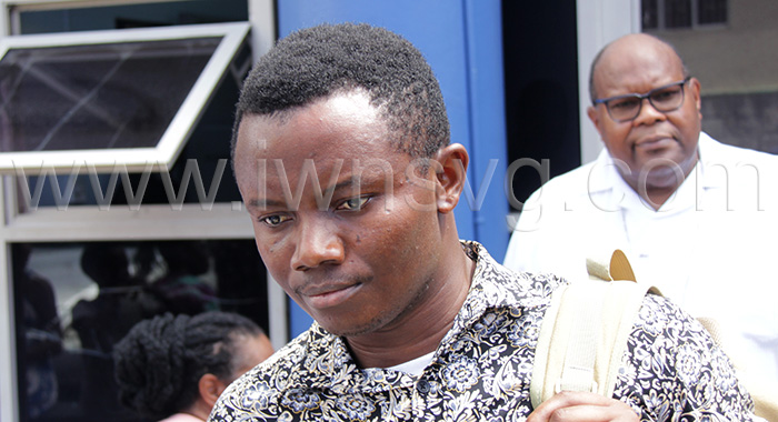 The accused priest, Kizito Igwebudul leaves the Kingstown Magistrate's Court in the company of the Bishop of the Diocese of Kingstown, Gerard County, in the background, on Monday, Oct. 23, 2023.