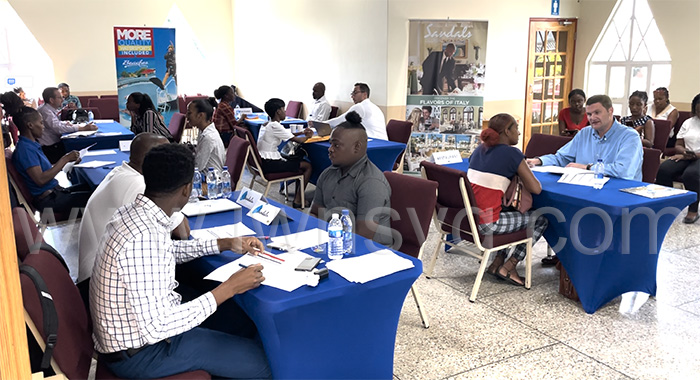Job seekers being interviewed at the Sandals job fair in Kingstown on Friday, Sept. 29, 2023.