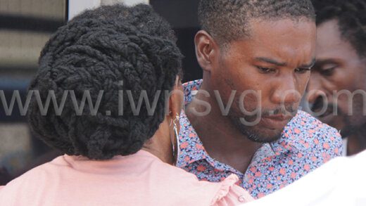 Shawn Collis interacts with his mother outside Kingstown Magistrate's Court after the sentence was handed down on him on Monday, Oct. 23, 2023.