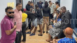 Staff of the Inland Revenue Department and other members of the public as the staff members prayed for their embattled colleagues on Monday, Nov. 13, 2023.
